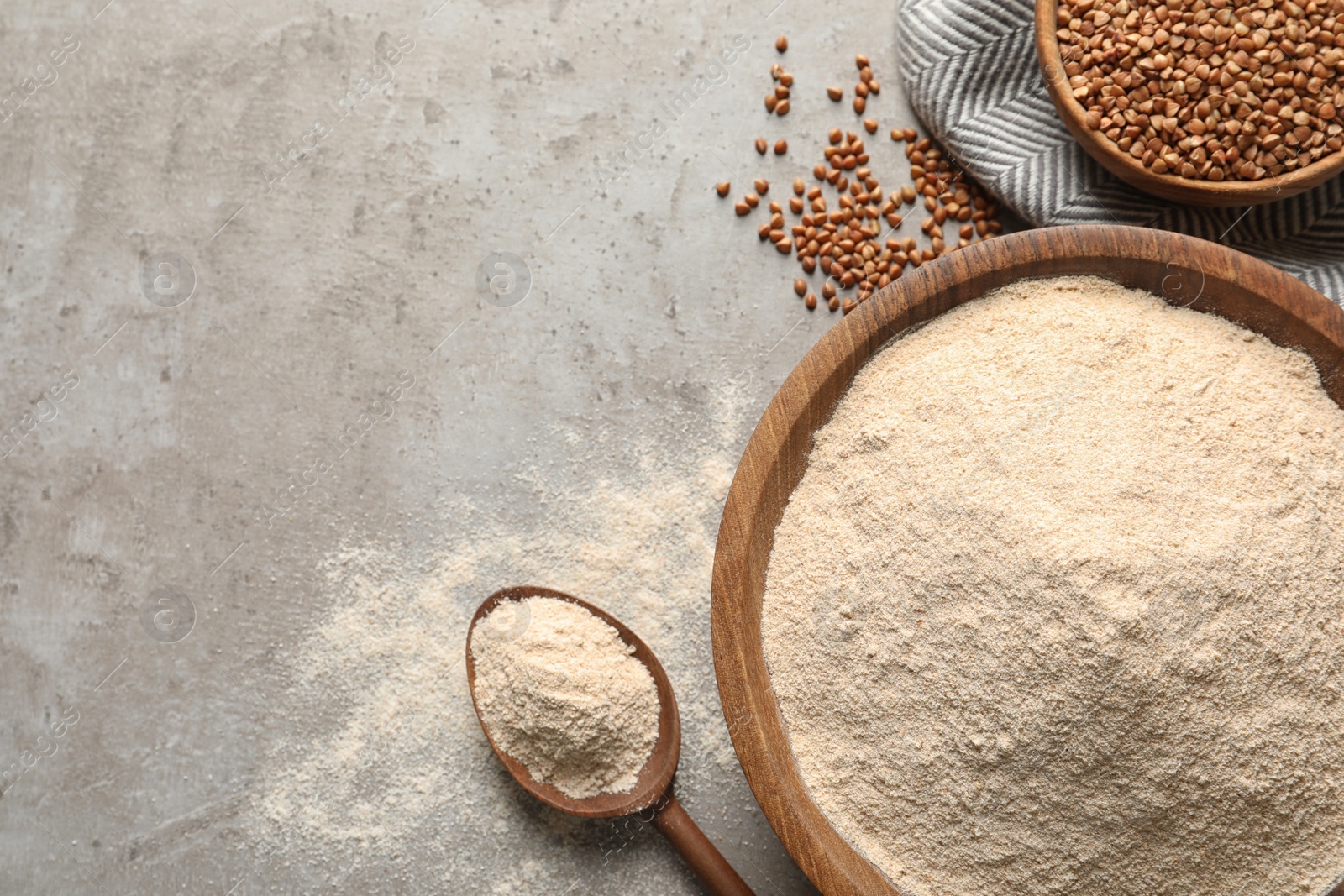 Image of Flat lay composition with buckwheat flour on grey table, space for text