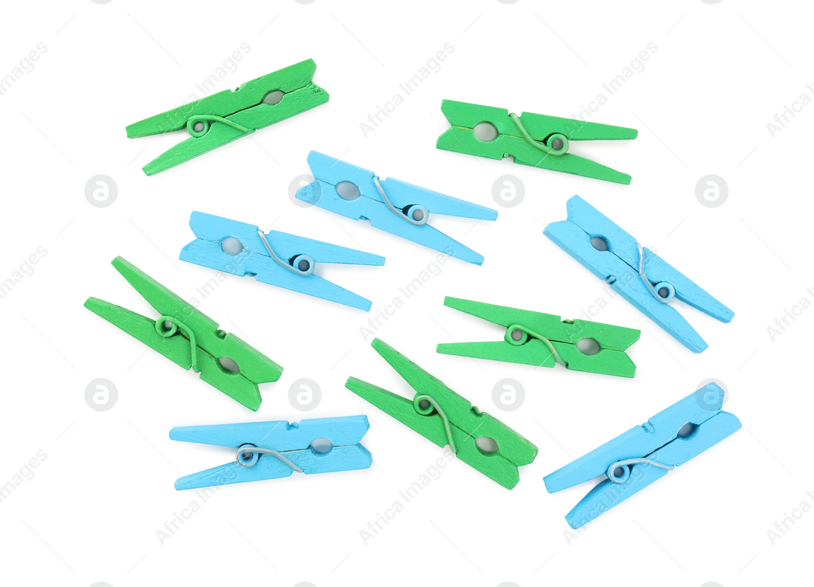 Photo of Many colorful wooden clothespins on white background, top view