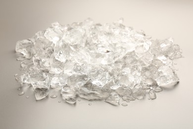 Photo of Pieces of crushed ice on grey background