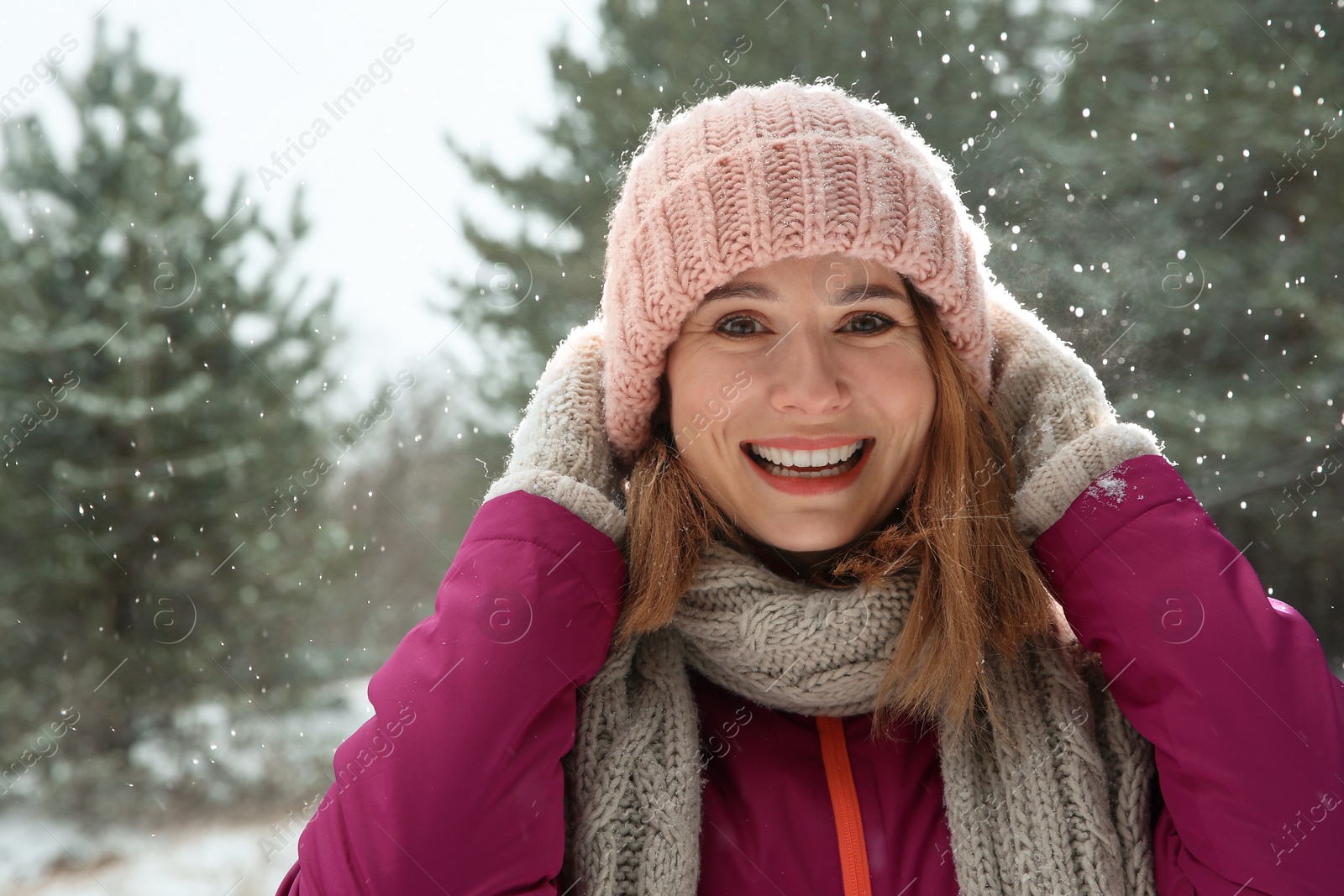 Photo of Portrait of beautiful woman in snowy forest