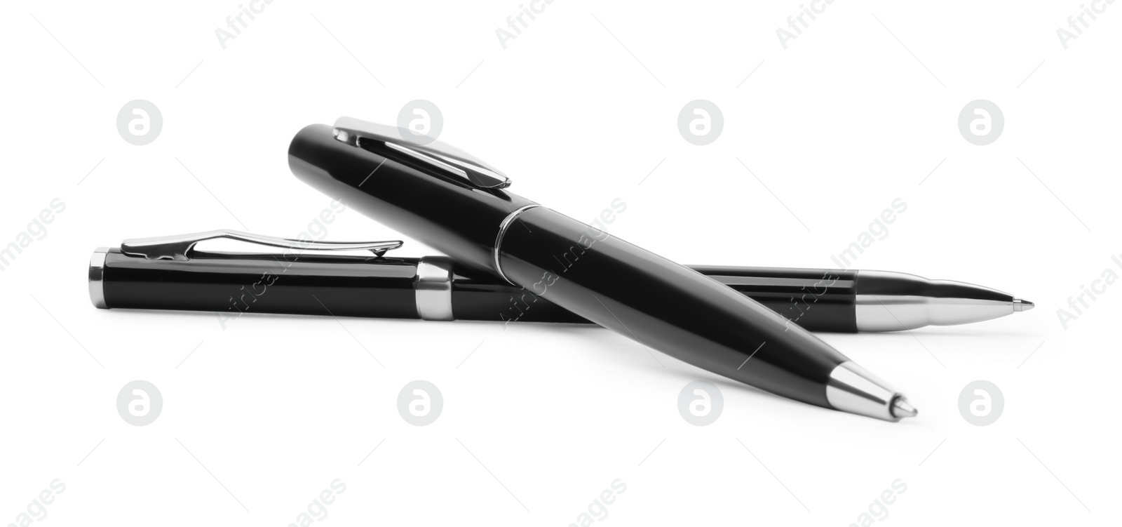 Photo of New stylish black pens isolated on white