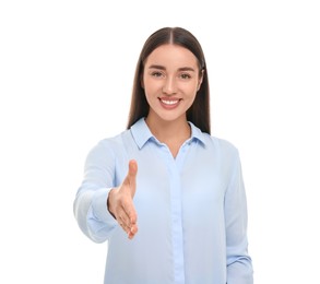 Photo of Happy young woman welcoming and offering handshake isolated on white