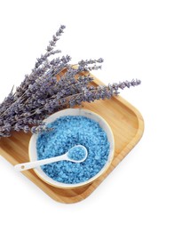 Photo of Bowl with blue sea salt and lavender flowers isolated on white, top view