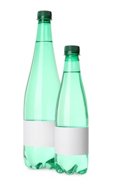 Bottles of pure water with blank labels on white background