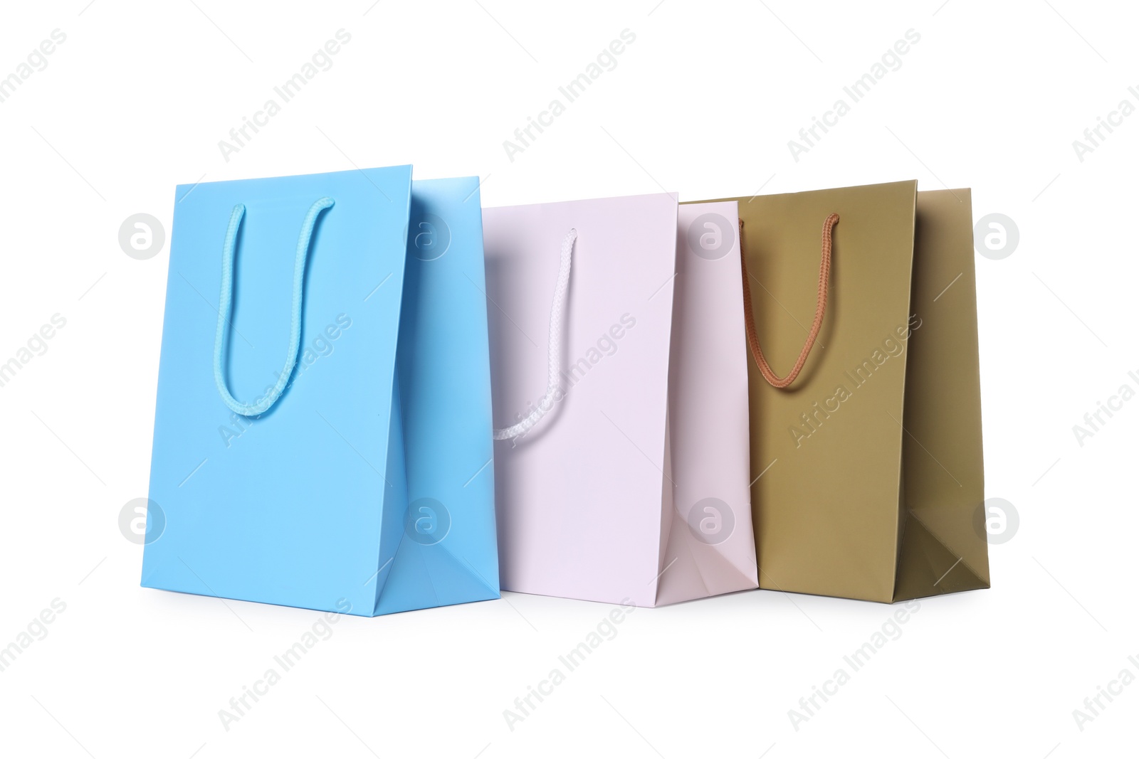 Photo of Colorful paper shopping bags isolated on white