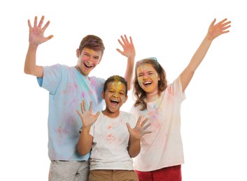 Photo of Group of friends covered with colorful powder dyes on white background. Holi festival celebration