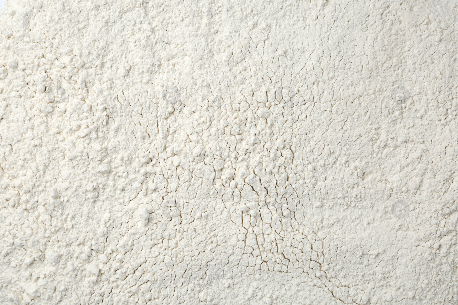 Photo of Pile of organic flour as background, top view