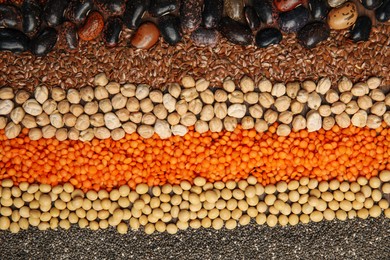 Photo of Different grains and seeds as background, top view. Veggie diet