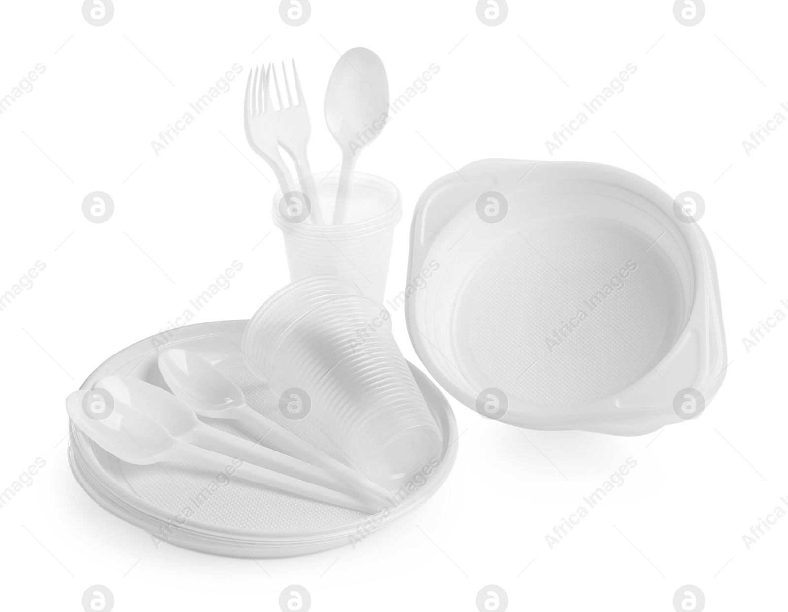 Photo of Set of disposable tableware on white background