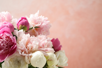 Photo of Beautiful peony bouquet on pink background, closeup