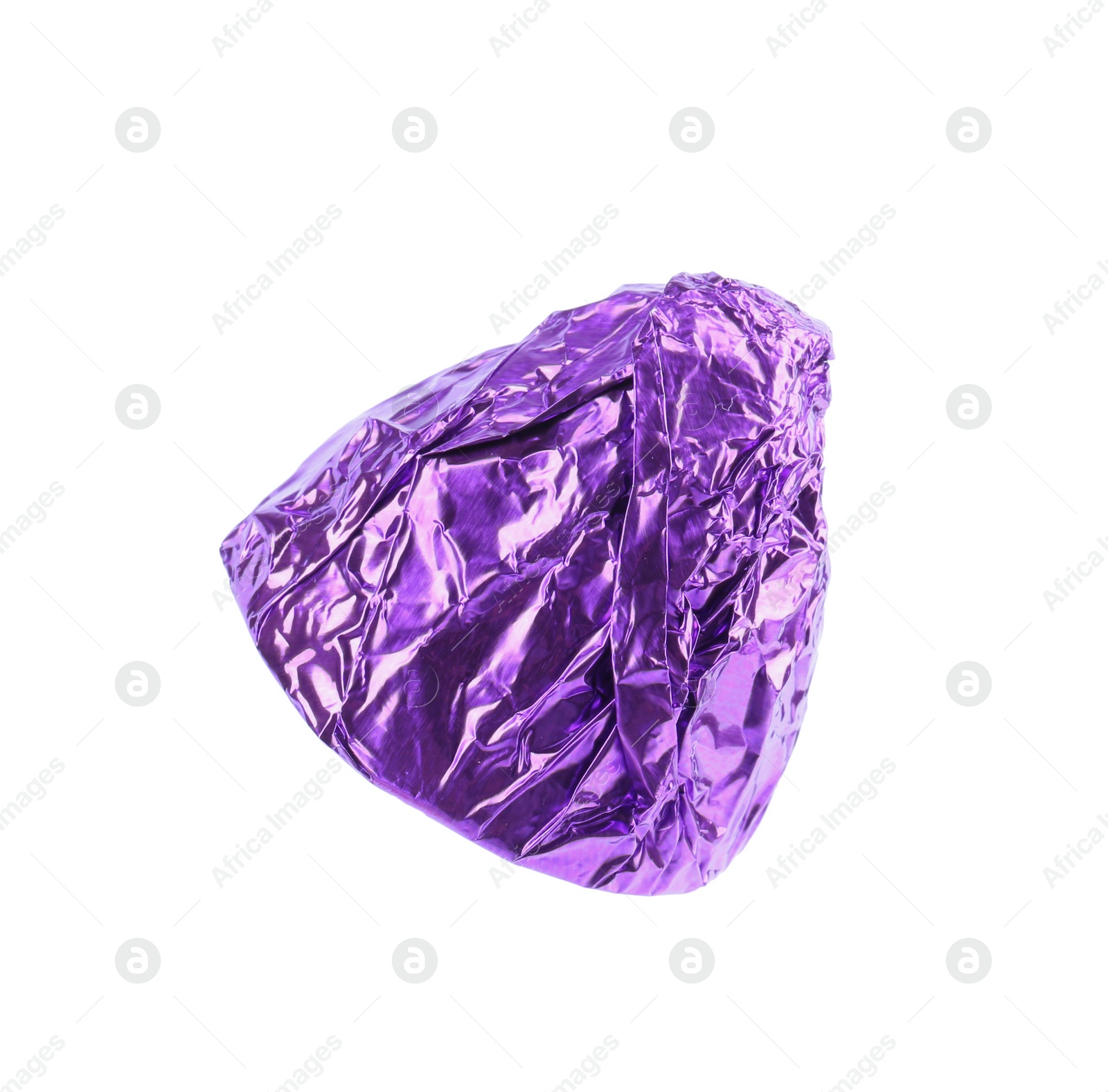 Photo of Tasty candy in purple wrapper isolated on white