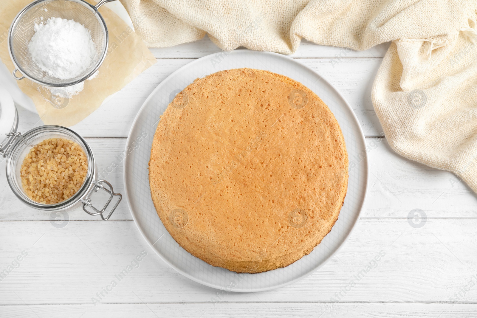 Photo of Flat lay composition with delicious fresh homemade cake on white wooden table