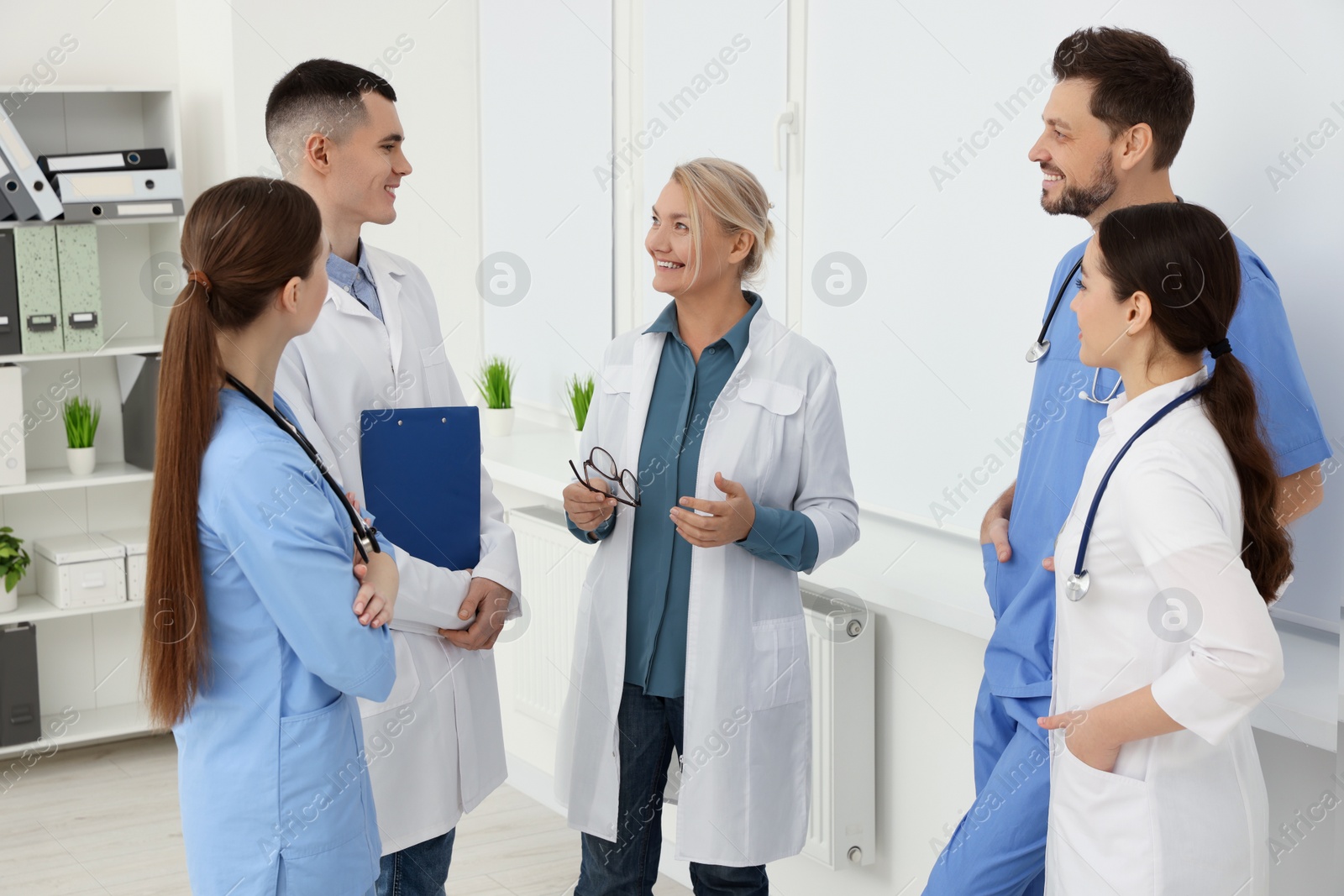 Photo of Team of doctors having discussion in clinic