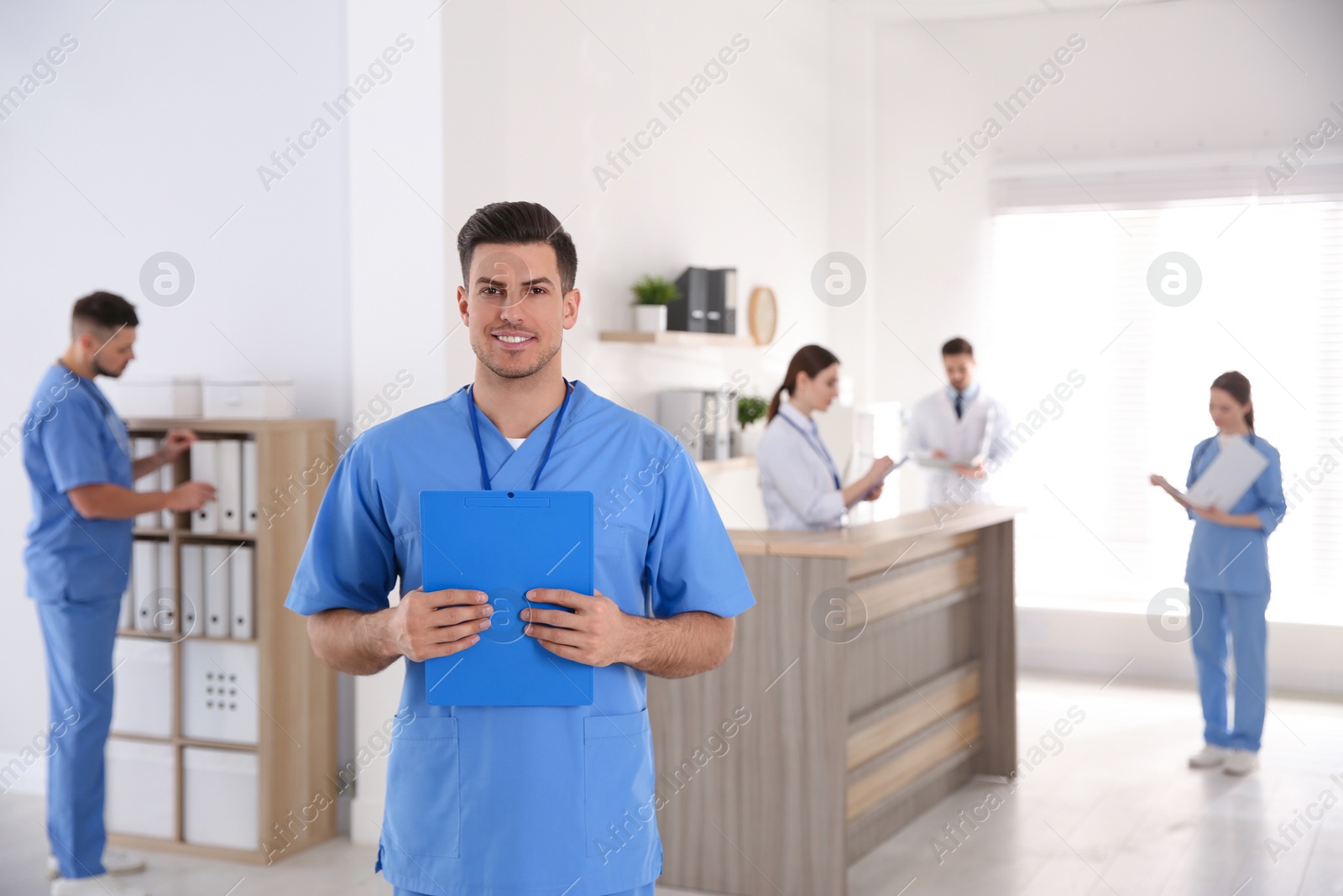 Photo of Portrait of male doctor in modern clinic