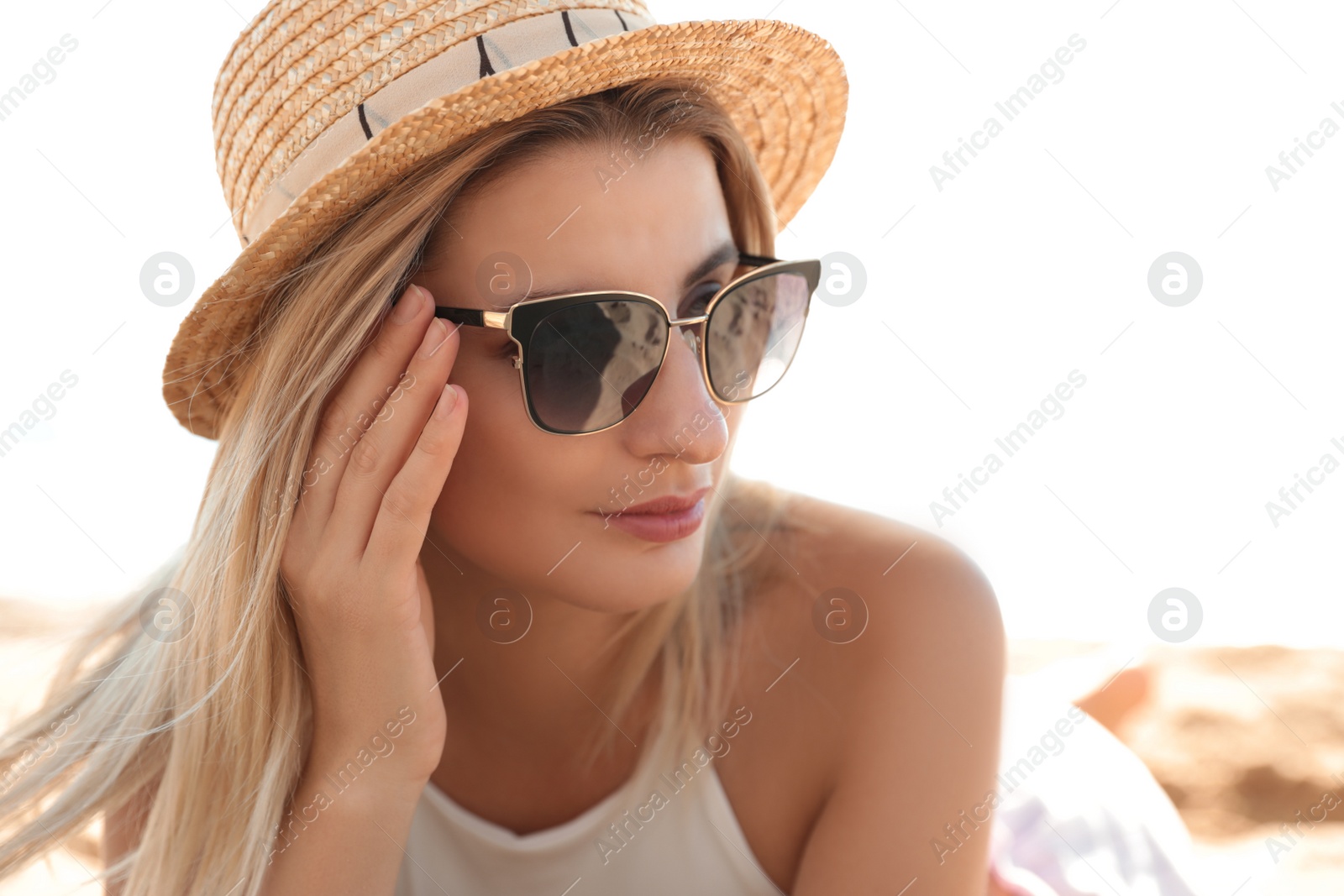 Photo of Beautiful woman wearing sunglasses outdoors on sunny day