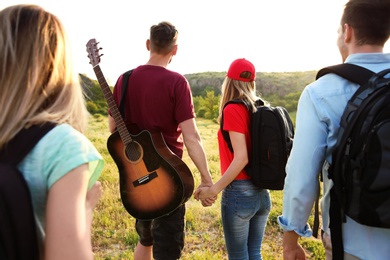 Group of young people in wilderness. Camping season