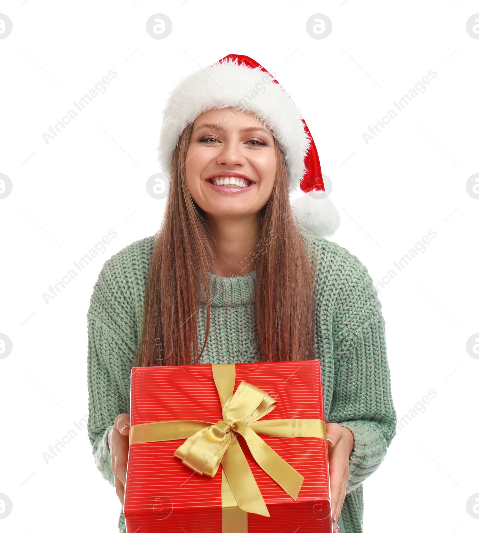 Photo of Happy young woman in Santa hat with Christmas gift on white background