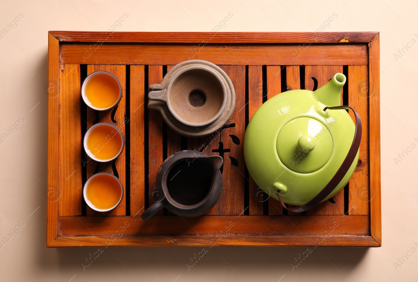 Photo of Beautiful set for traditional tea ceremony on beige background, top view