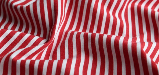 Photo of Texture of red striped fabric as background, closeup
