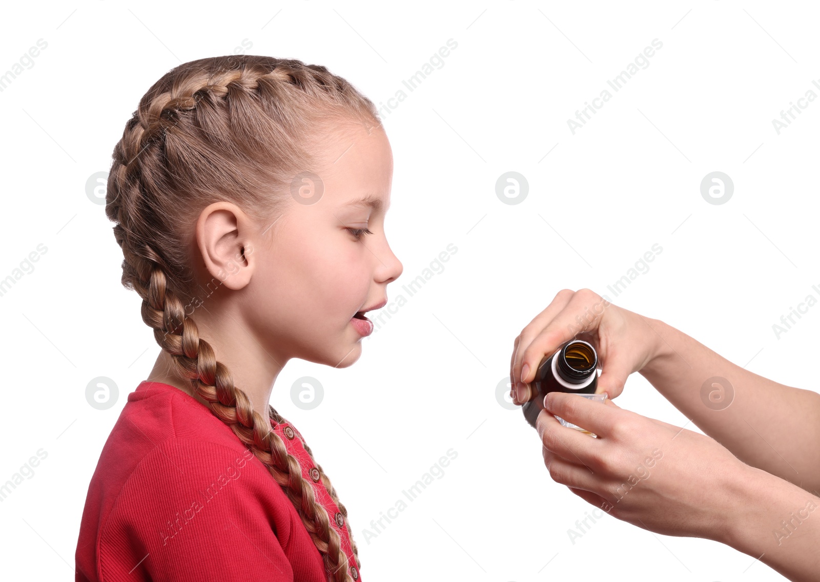 Photo of Mother pouring syrup into measuring cup for her daughter on white background