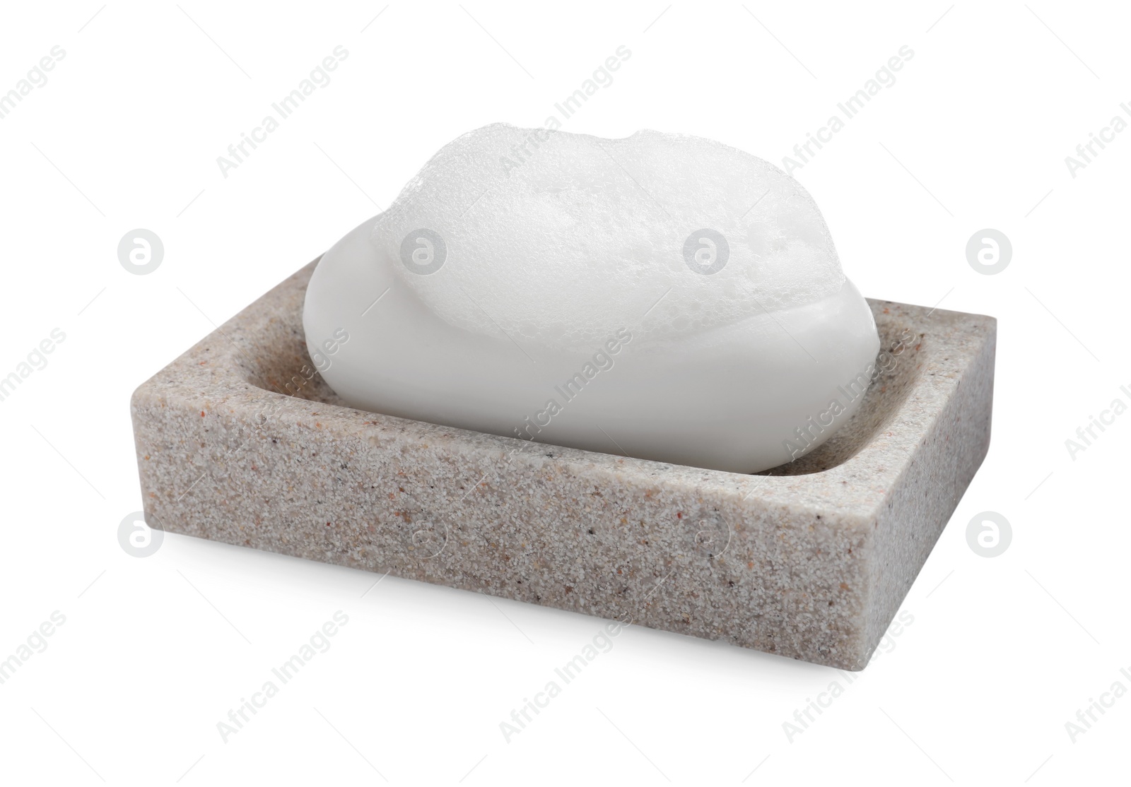 Photo of Soap bar with fluffy foam in holder on white background