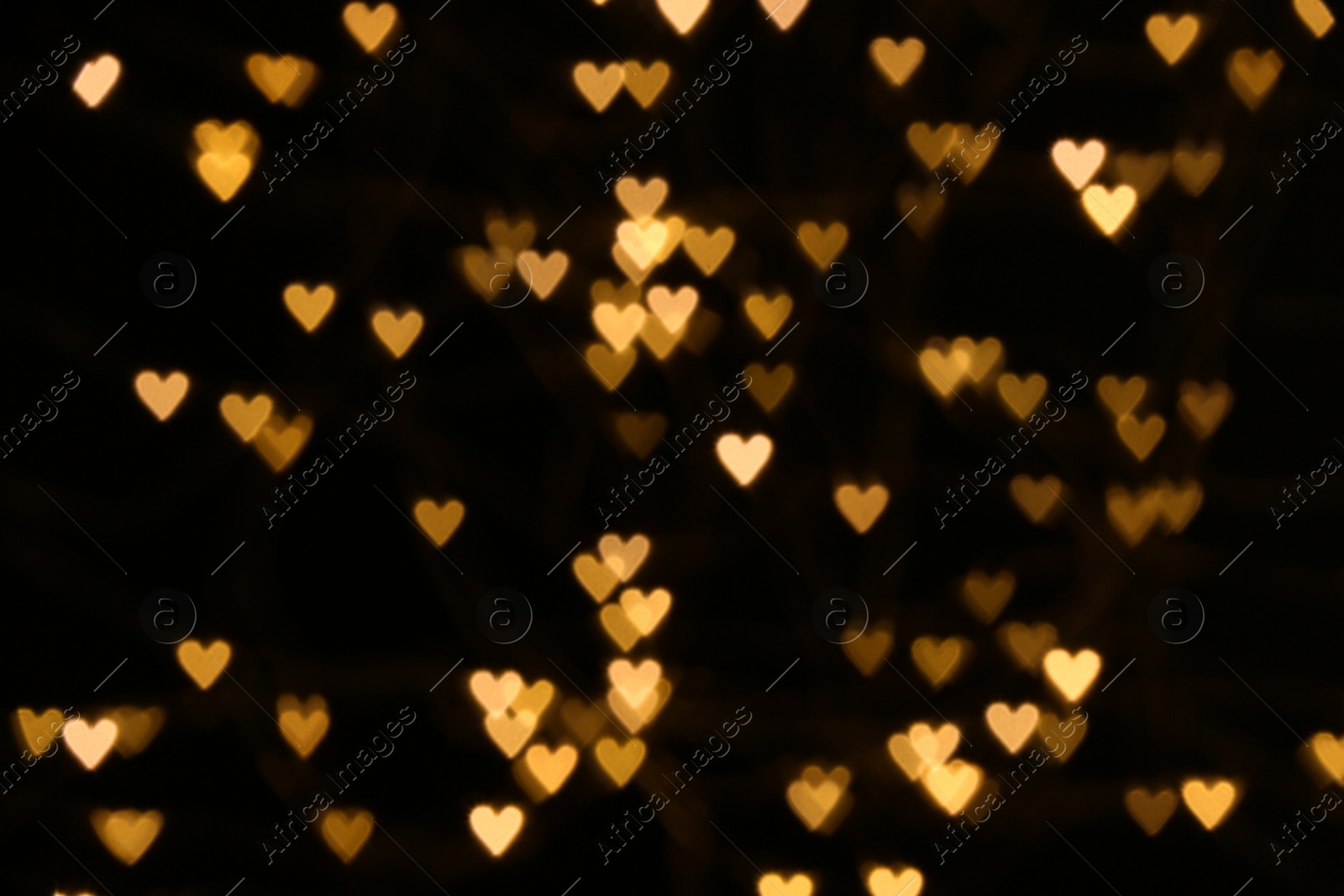 Photo of Blurred heart shaped lights as festive background