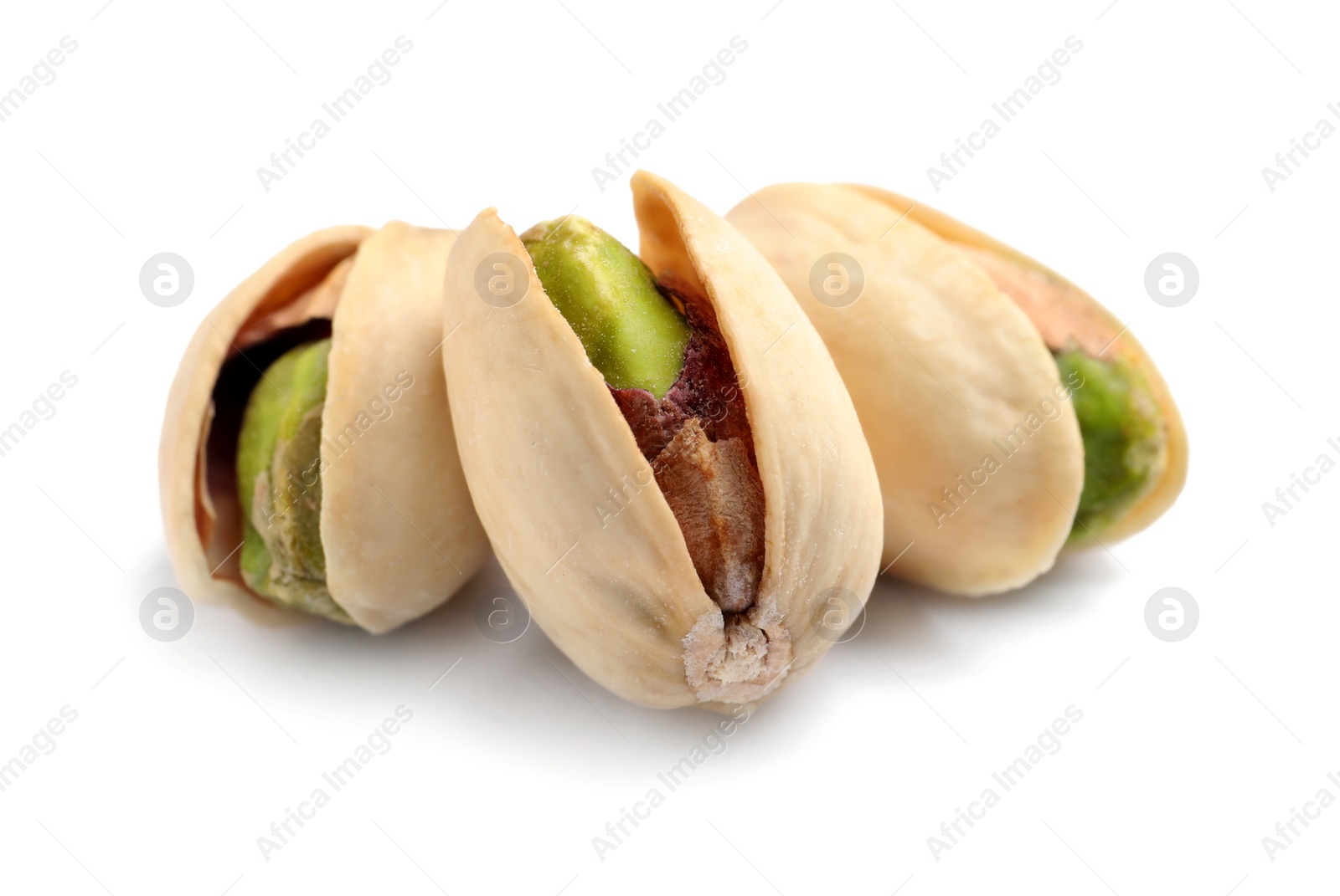 Photo of Tasty organic pistachio nuts on white background, closeup