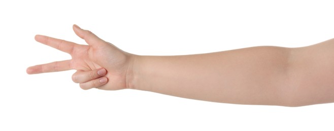 Playing rock, paper and scissors. Woman making scissors with her fingers on white background, closeup