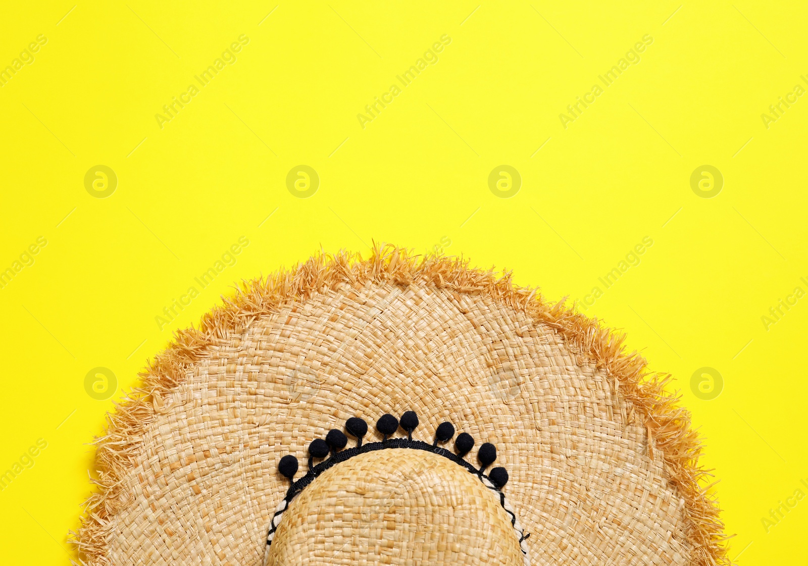 Photo of Stylish straw hat on color background, top view with space for text. Beach accessories