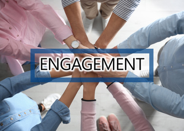 Engagement concept. People holding hands together, top view 