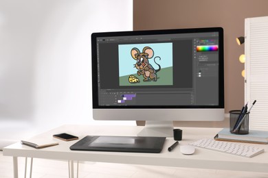 Image of Animator's workplace. Modern computer with illustration on screen