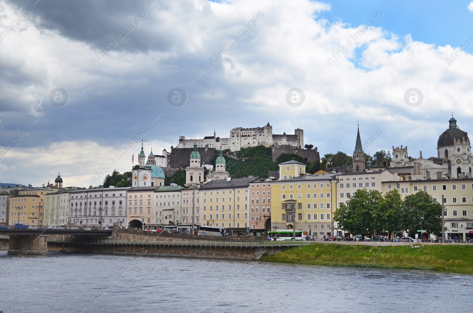 Photo of SALZBURG, AUSTRIA - JUNE 22, 2018: Picturesque view of city street on riverside