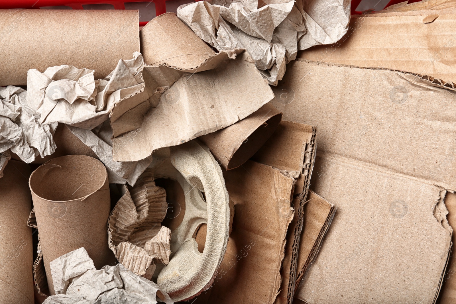 Photo of Pile of paper and cardboard garbage as background, top view. Recycling problem