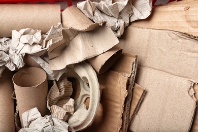 Pile of paper and cardboard garbage as background, top view. Recycling problem