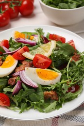 Photo of Delicious salad with boiled eggs, vegetables and bacon on table, closeup