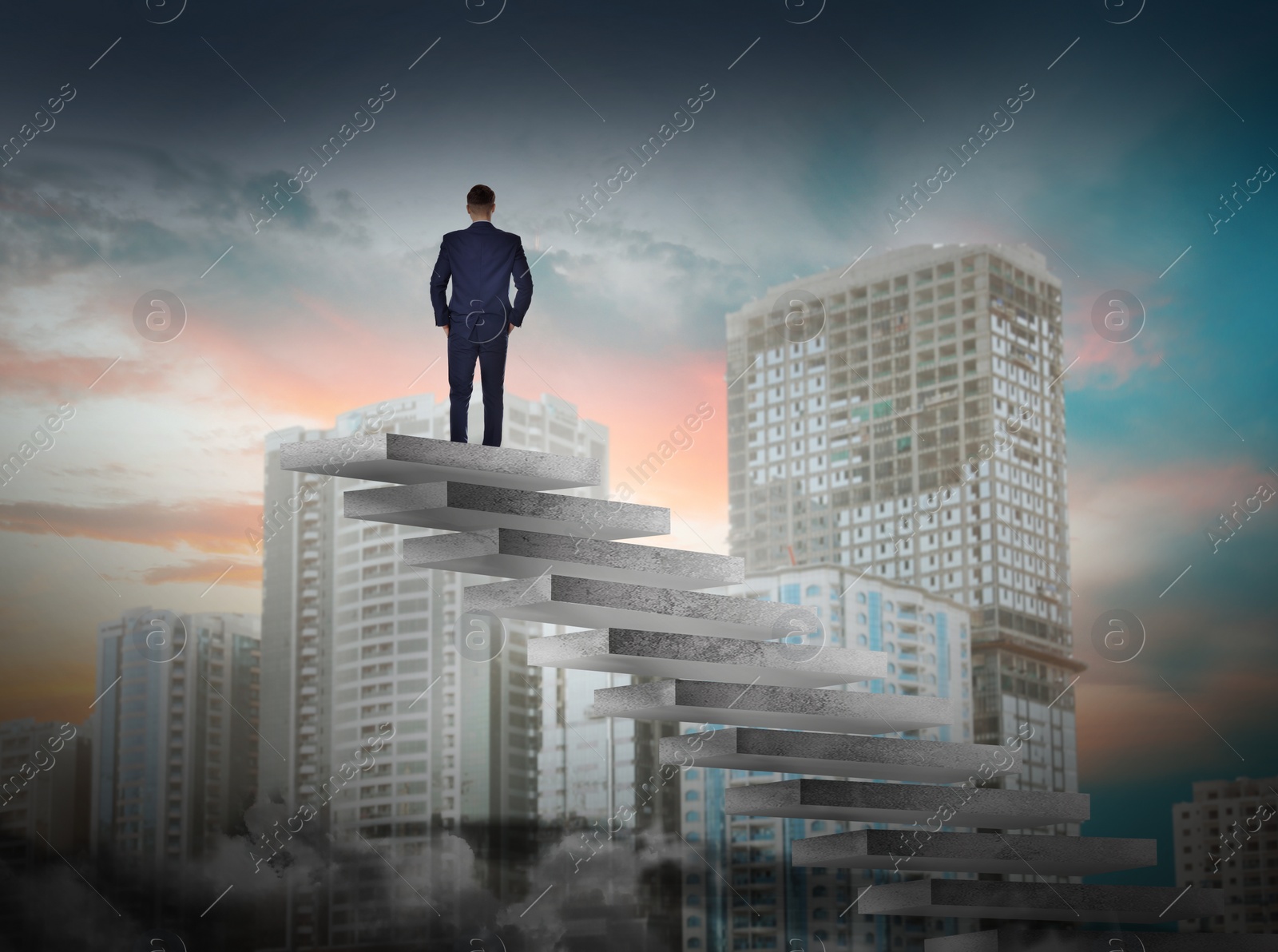 Image of Man standing on top of stairs and looking at cityscape. Way to success