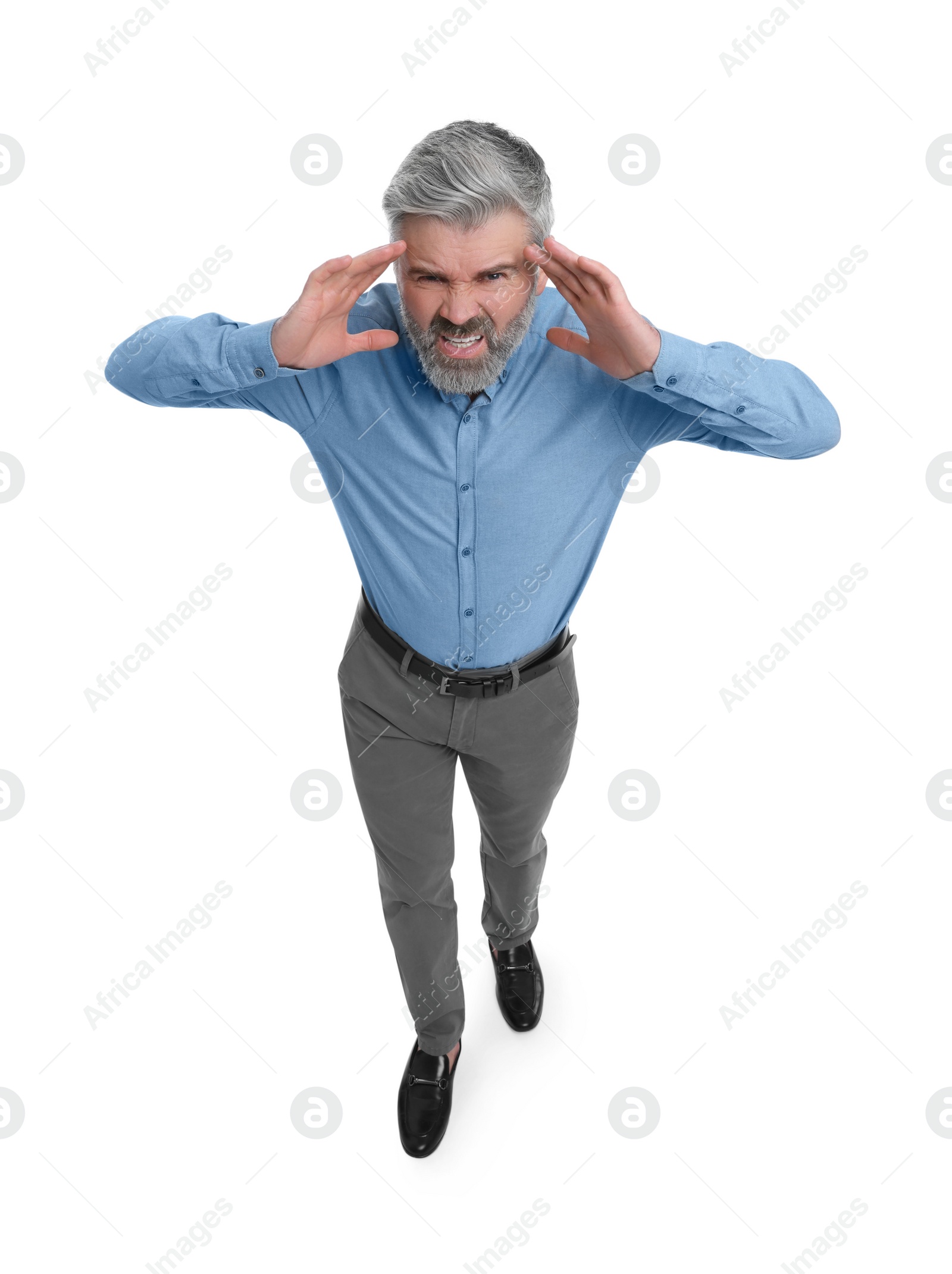 Photo of Emotional mature businessman in stylish clothes posing on white background