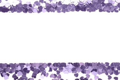 Photo of Frame made of bright confetti on white background, top view. Space for text