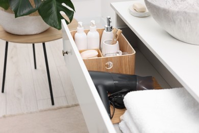 Photo of Different bath accessories and personal care products in drawer indoors