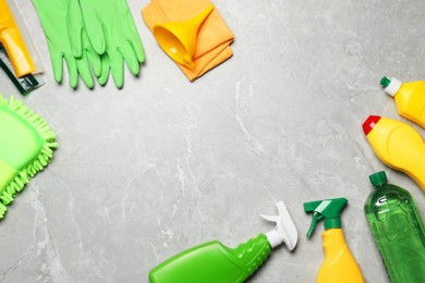 Photo of Flat lay composition with car cleaning products on light grey marble table. Space for text