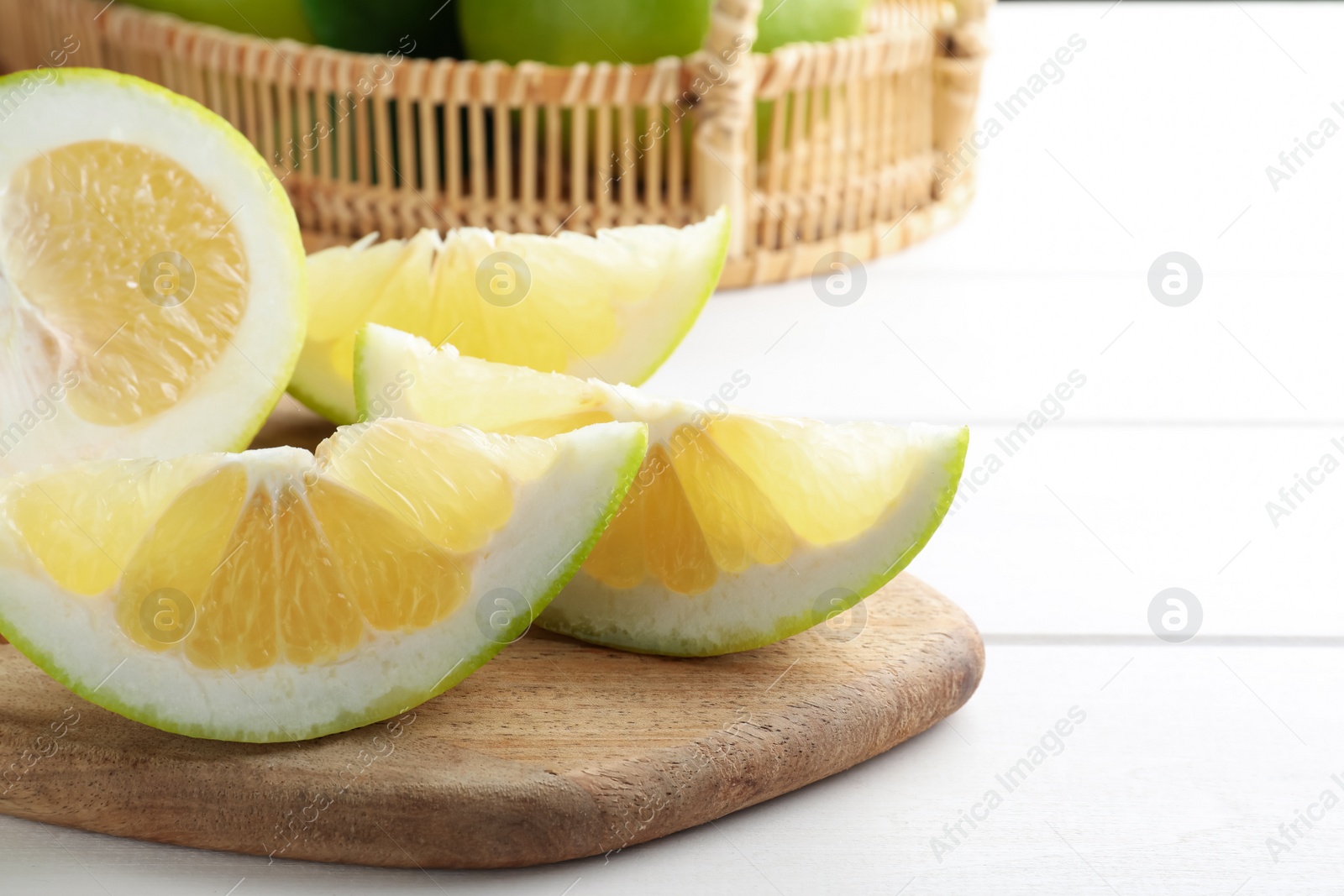 Photo of Cut fresh sweetie on white table, closeup