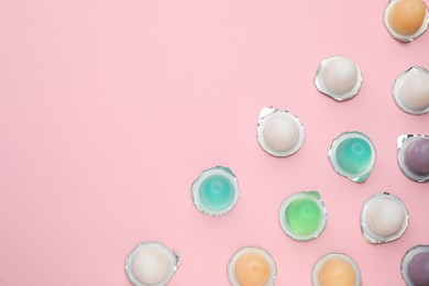 Photo of Tasty bright jelly cups on pink background, flat lay. Space for text