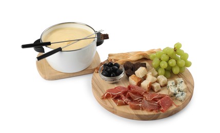 Photo of Fondue with tasty melted cheese, forks and different snacks isolated on white