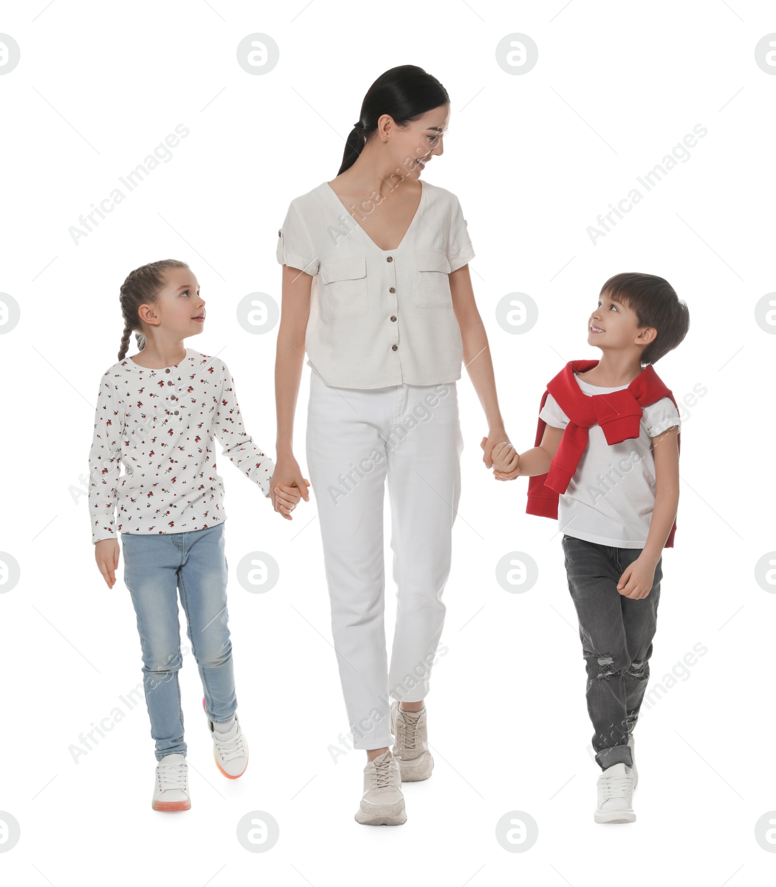 Photo of Little children with their mother together on white background