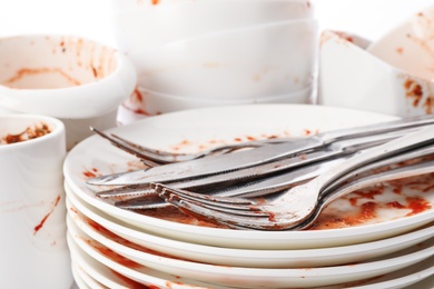 Photo of Pile of dirty dishes and cutlery, closeup