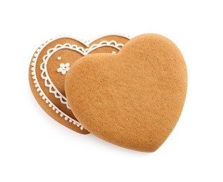 Photo of Tasty heart shaped gingerbread cookies isolated on white, above view