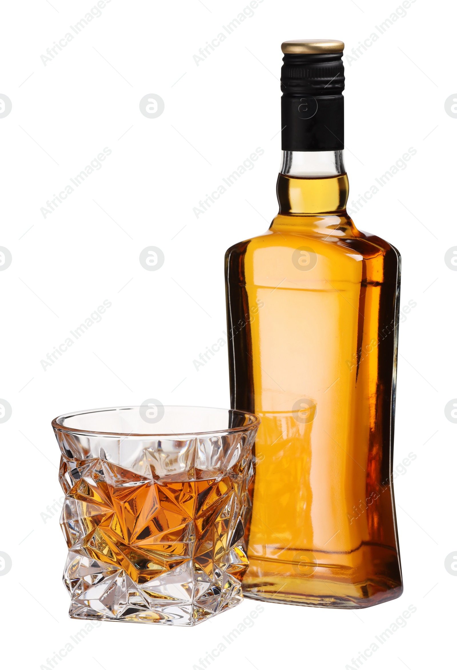 Photo of Glass and bottle of whiskey isolated on white