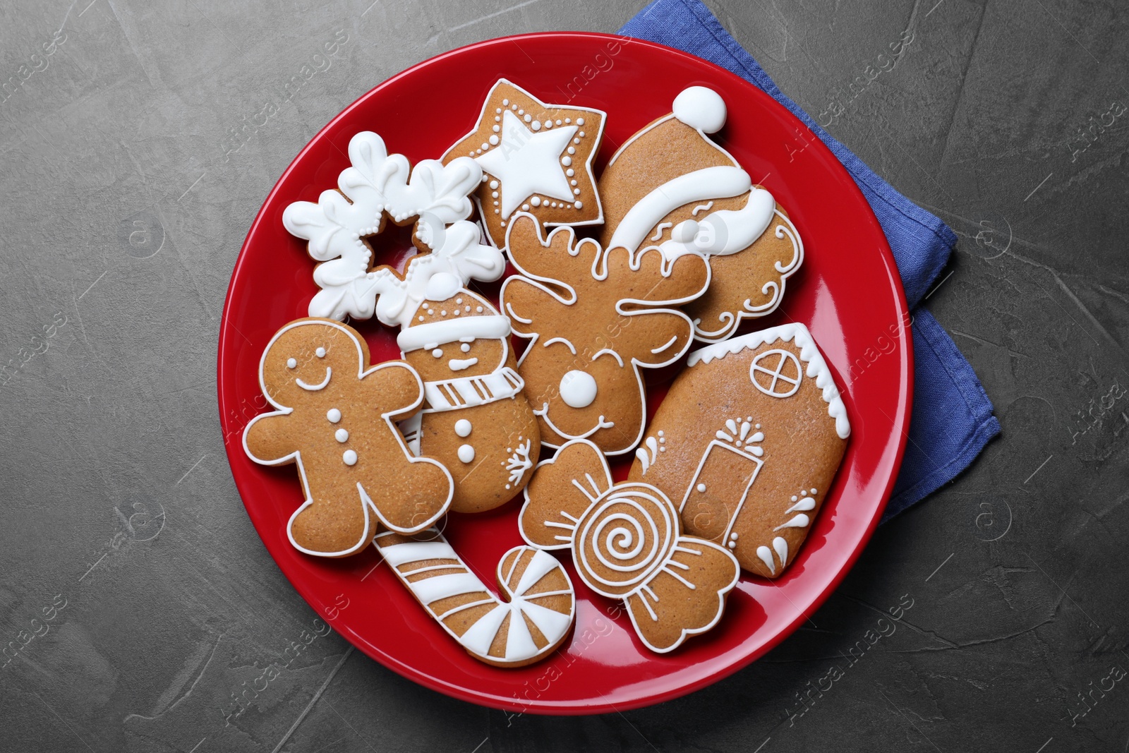 Photo of Tasty Christmas cookies on grey table, flat lay