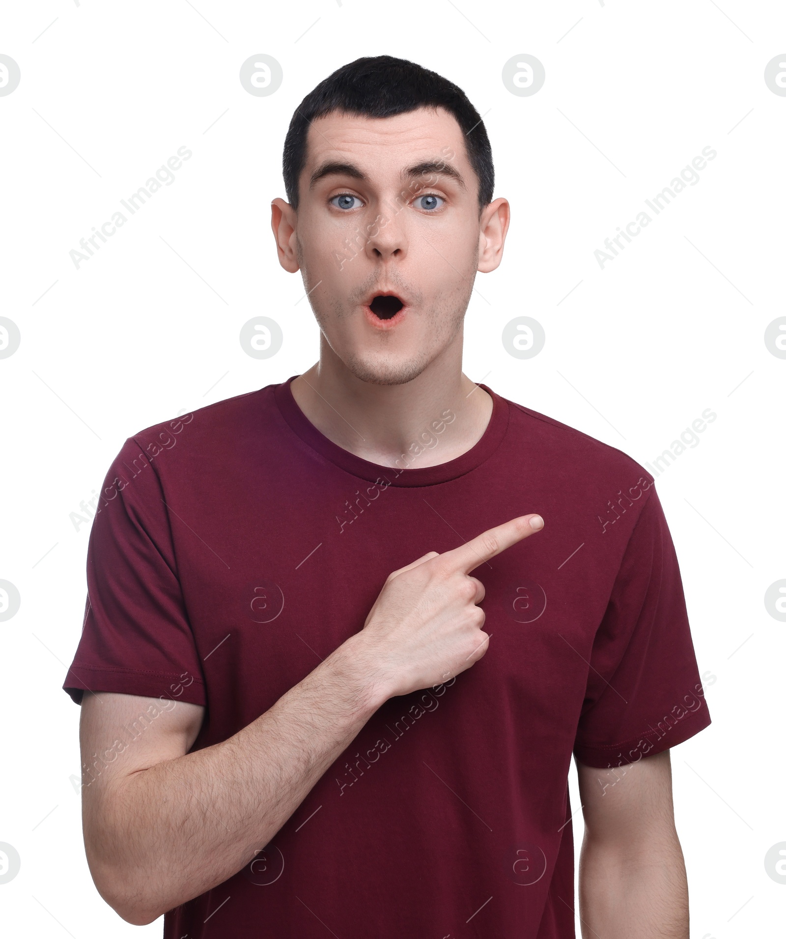 Photo of Surprised man pointing at something on white background