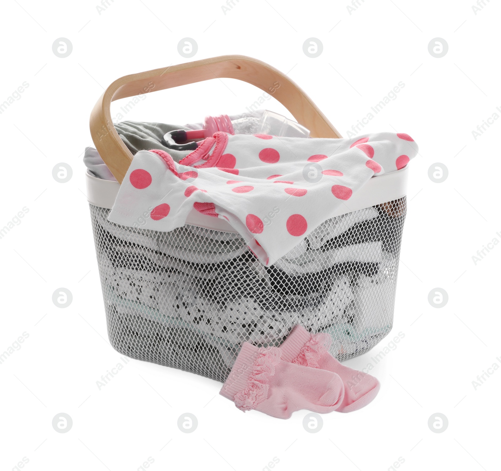 Photo of Laundry basket with baby clothes isolated on white